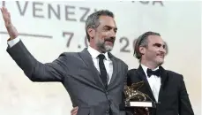  ??  ?? ‘Joker’ director Todd Phillips with the film’s star, Joaquin Phoenix, at last year’s Venice Internatio­nal Film Festival