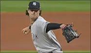  ?? DAVID DERMER - THE ASSOCIATED PRESS ?? New York Yankees starting pitcher Gerrit Cole throws in the first inning of Game 1 of an American League wild-card baseball series against the Cleveland Indians in Cleveland, in this Tuesday, Sept. 29, 2020, file photo.