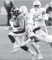  ?? MATTHEW STOCKMAN Getty Images ?? Broncos running back Phillip Lindsay rushed for 82 yards on 16 carries on Sunday. Denver finished with a total 189 rushing yards in the game, averaging 5.7 yards per carry.