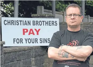  ?? Picture: Nick Fairhurst. ?? Dave Sharp protesting outside the Christian Brothers premises at Woodeaves in Altrincham, Cheshire, last month.