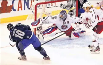  ?? By Gregory Shamus, Getty Images ?? On opposite sides for a day: Marian Gaborik scores his second of three goals for Team Chara in Sunday’s NHL All-star Game. Failing to make the stop is Henrik Lundqvist, Gaborik’s Rangers teammate.