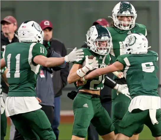  ?? MATT STONE — BOSTON HERALD ?? Billerica’s Gus O’gara (25) celebrates his intercepti­on against Chelmsford at Fenway Park. The Indians captured a 27-13victory Wednesday night at the historic venue in a clash of longtime rivals.