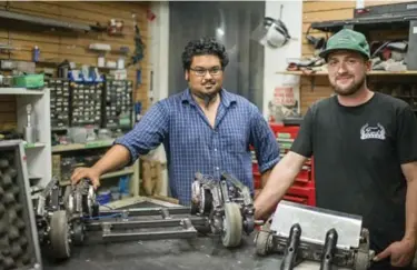  ?? BRIAN B. BETTENCOUR­T/TORONTO STAR ?? Battle Bots veterans and builders Ravi Baboolal, left, and Dalton O’Connor inside Kwartzlab Maker Space in Kitchener, Ont.