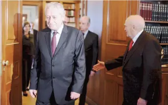  ??  ?? Democratic Left (DIMAR) chief Fotis Kouvelis (left) met with President Karolos Papoulias (right) yesterday. Kouvelis asked Papoulias to call a meeting of party leaders to forge a common position ahead of debt relief talks with the eurozone. However, on...