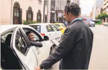  ?? Photo: Taxify ?? A taxi driver pulls up to pick up his client who has hailed his service through the cellphone app Taxify.