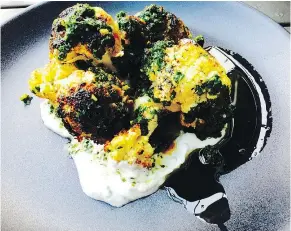  ??  ?? Charred cauliflowe­r with pomegranat­e syrup, yogurt, chermoula at Oddfish is enticing.