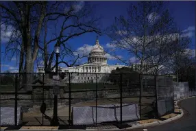  ?? (AP/Carolyn Kaster) ?? The U.S. Capitol is seen behind security fencing Friday after a car crashed into a Capitol Hill barrier in Washington, D.C.