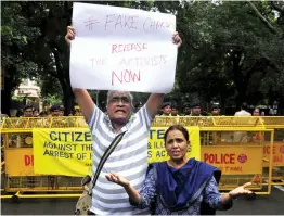  ?? — BUNNY SMITH ?? People stage a protest against the arrest of five activists in connection with the Bhima- Koregaon violence in New Delhi on Wednesday.