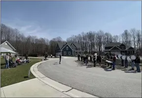  ?? MARAH MORRISON — THE NEWS-HERALD ?? Community members, friends and relatives rallied around the homecoming of Ashton Staton during a drive-by parade led by the Concord Township Fire Department.