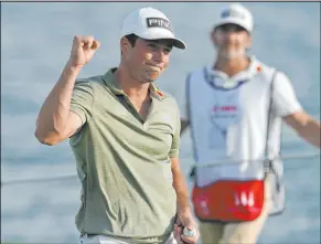  ?? Fernando Llano The Associated Press ?? Viktor Hovland celebrates after winning the Hero World Challenge on Sunday at the Albany Golf Club in New Providence, Bahamas, for his third victory of 2021.