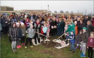  ??  ?? Mary Stack with her mother planting a tree at Ardfert National School in memory of Thomas Stack on Saturday with family and friends gathered to mark the occasion.