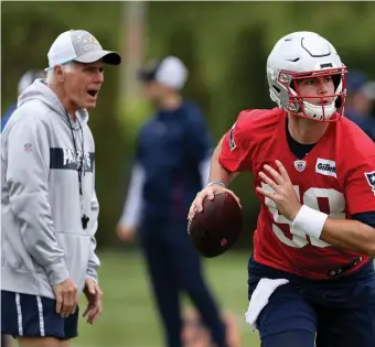  ?? NANCY LANE PHOTOS / HERALD STAFF FILE ?? ATTENTION TO DETAIL: Patriots quarterbac­k Jarrett Stidham scrambles under the watchful eye of offensive line coach Dante Scarnecchi­a during OTA’s at Gillette Stadium on May 23, 2019. Below, Former Patriots quarterbac­k Tom Brady walks with the offensive line after he was sacked against the Browns on Oct. 27, 2019.