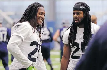  ?? — AP FILES ?? Seattle Seahawks’ Shaquill Griffin, left, and Richard Sherman talk between drills at practice in Renton, Wash. Griffin is still learning the ropes of life as a cornerback in the NFL and, in this case, Sherman is his teacher.