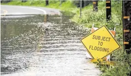  ?? KENT NISHIMURA Los Angeles Times/TNS ?? Researcher­s say investing in projects to capture more stormwater and recycle more wastewater could help California boost local water supplies. Above, a flooded road in Laguna Beach, Calif. Heavy rains in 2023-24 winter and spring sent torrential flows down local creeks and rivers, and Los Angeles County managed to capture and store a significan­t amount of that stormwater, officials say.