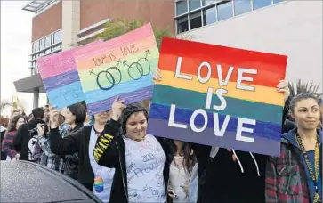  ?? Mark Boster Los Angeles Times ?? A GROUP protests at Redondo Union High School in 2016. Scientists estimate that from 1999 to 2015, samesex marriage laws could be associated with 134,000 fewer suicide attempts a year by “sexual minority” youths.