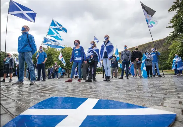  ?? Picture: Jane Barlow/pa ?? Members from All Under One Banner take part in a static demonstrat­ion for Scottish independen­ce outside the Scottish Parliament in Edinburgh