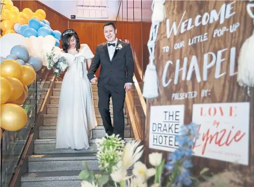  ?? RICHARD LAUTENS PHOTOS/TORONTO STAR ?? Diane Huynh and Andrew Tran were one of eight couples to get married at the pop-up wedding chapel on the rooftop of the Drake Hotel on Feb. 16.