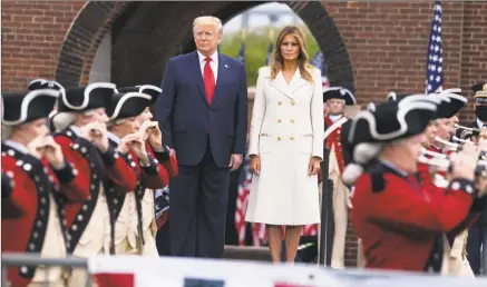  ?? Evan Vucci / Associated Press ?? President Donald Trump and first lady Melania Trump participat­e in a Memorial Day ceremony at Fort McHenry National Monument and Historic Shrine on Monday in Baltimore.