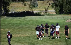  ?? Fort Morgan Times file photo ?? Fort Morgan High School football players get in a practice with helmets and pads in mid-August in 2019.