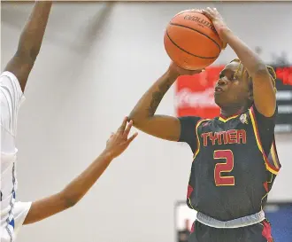  ?? STAFF PHOTO BY MATT HAMILTON ?? Tyner’s Shy Harrison shoots against Red Bank during a first-round game in the Times Free Press Best of Preps basketball tournament Thursday at Chattanoog­a State.