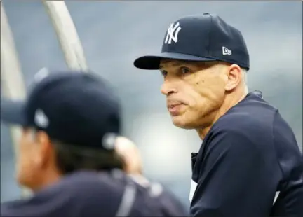  ?? KATHY WILLENS — ASSOCIATED PRESS ?? Yankees manager Joe Girardi watches his team take batting practice before Sunday night’s Game 3 of American League Division Series game the Indians.