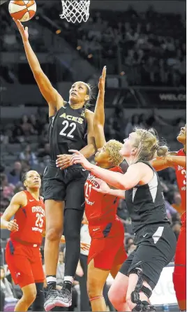  ?? Richard Brian ?? Las Vegas Review-journal @vegasphoto­graph Aces center A’ja Wilson (22) shoots over Washington Mystics forward Tianna Hawkins (21) in the second half Friday at the Mandalay Bay Events Center.