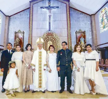  ??  ?? (From left) Lawyers Benjamin Aritao and Grace Pastorfide-Aritao with daughter Ellie, Georgia Pastorfide, Bishop Ruperto Santos, Dr. Gina Pastorfide, Knights of Silvester awardee Dr. Gregorio Pastorfide, doctors Gayle and Gia Pastorfide