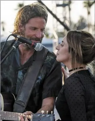  ??  ?? Bradley Cooper as Jackson and Lady Gaga as Ally in AStarIsBor­n.