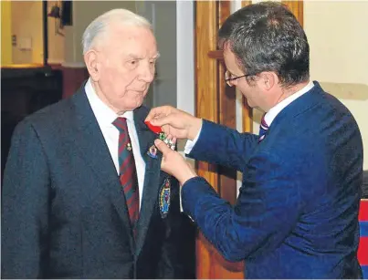  ?? Picture: PA. ?? Samuel Irvine Rae collects his Legion d’honneur from French consul general in Scotland Emmanuel Cocher at Leuchars.