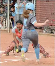  ??  ?? KOFA CATCHER CHLOE GARCIA (LEFT) waits to put the out tag on Gila Ridge’s Hailey Matthews at home during Tuesday afternoon’s game at John Boemer Sports Complex, Caballeros Field.