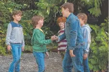  ??  ?? Julia Roberts and Jacob Tremblay, centre, Tremblay gets a cheer from his classmates, and right, Tremblay (in green hoodie) dealing with some of the bigger kids around school