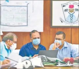  ??  ?? Chief minister Kejriwal and Delhi health minister Satyendar Jain visited GTB hospital to review the ongoing work and video calling facility for Covid-19 patients and their family members.