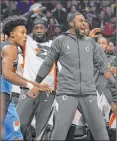  ?? Mark J. Terrill The Associated Press ?? Clippers substitute­s celebrate from the bench versus the Cavs on Jan. 14.