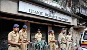  ??  ?? Security increased outside Zakir Naik’s office in Mumbai on Friday. IANS