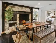  ?? ?? The dining area and kitchen inside the home.