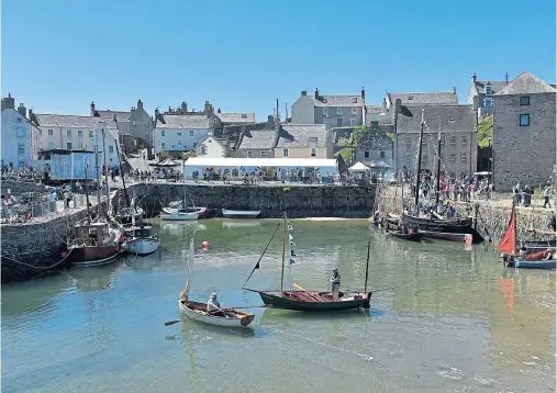  ??  ?? SCENE STEALER: The Scottish Traditiona­l Boat Festival is held at Portsoy harbour, which was used as a location for Whisky Galore in 2016