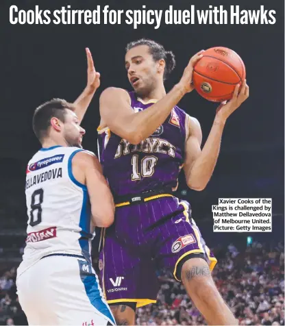  ?? ?? Xavier Cooks of the Kings is challenged by Matthew Dellavedov­a of Melbourne United. Picture: Getty Images