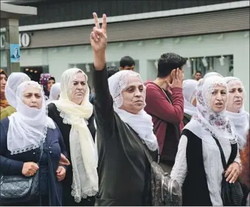  ?? Ilyas Akengin AFP/Getty Images ?? MEMBERS of the pro-Kurdish People’s Democratic Party show solidarity with hunger strikers in Diyarbakir, Turkey. The party has called for political dialogue between the government and the Kurdistan Workers Party.