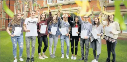  ??  ?? ●●Students at Cheadle Hulme School celebrate their GCSE results