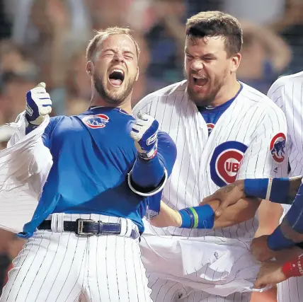  ?? NUCCIO DINUZZO/CHICAGO TRIBUNE ?? Cubs third baseman David Bote celebrates after hitting his game-winning grand slam last week.