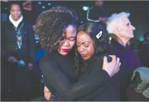  ?? GRAHAM HUGHES / THE CANADIAN PRESS ?? Two women embrace during an event in Montreal on Sunday to commemorat­e the 10-year anniversar­y of the devastatin­g earthquake in Haiti.