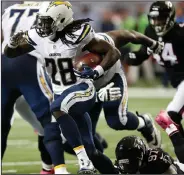  ?? AP PHOTO ?? San Diego Chargers running back Melvin Gordon (28) runs against the Atlanta Falcons during the game Sunday in Atlanta.