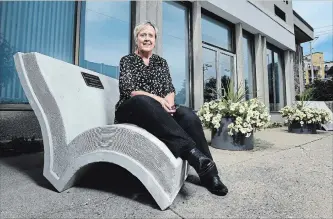  ?? MATHEW MCCARTHY WATERLOO REGION RECORD ?? Dolores Steffler sits on a concrete bench shaped like a book outside the Waterloo Public Library main branch.