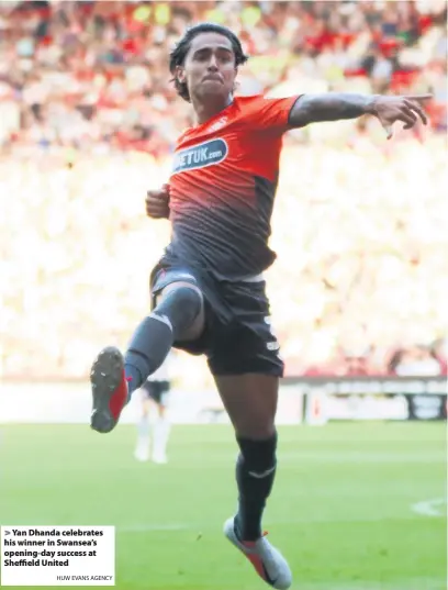  ?? HUW EVANS AGENCY ?? &gt; Yan Dhanda celebrates his winner in Swansea’s opening-day success at Sheffield United