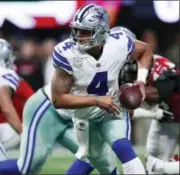  ?? JEFF HAYNES — THE ASSOCIATED PRESS ?? Dallas Cowboys quarterbac­k Dak Prescott (4) hands the ball off against the Atlanta Falcons during an NFL football