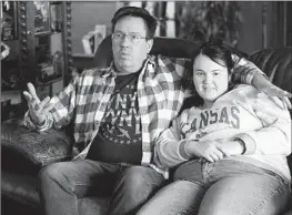  ?? John Hanna Associated Press ?? RICK ELSKAMP and his 23-year-old daughter, Sheridan, waited 10 years to receive state-covered day services for intellectu­ally disabled residents in Kansas.