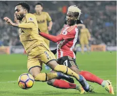 ??  ?? Didier Ndong challenges Spurs’ Danny Rose