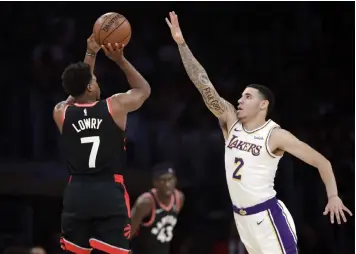  ??  ?? Toronto Raptors' Kyle Lowry (7) shoots over Los Angeles Lakers' Lonzo Ball (2) during the first half of an NBA basketball game in Los Angeles. (AP Photo/Marcio Jose Sanchez)