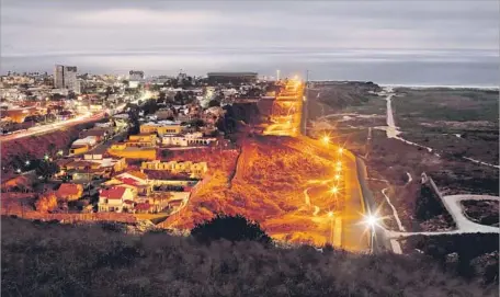  ?? Gary Coronado Los Angeles Times ?? PRESIDENT TRUMP has threatened a government shutdown over funding for a border wall. Above, Tijuana, left, and San Diego.