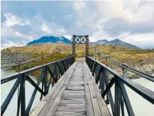  ??  ?? this wooden bridge was built a century ago, and still stands strong today.